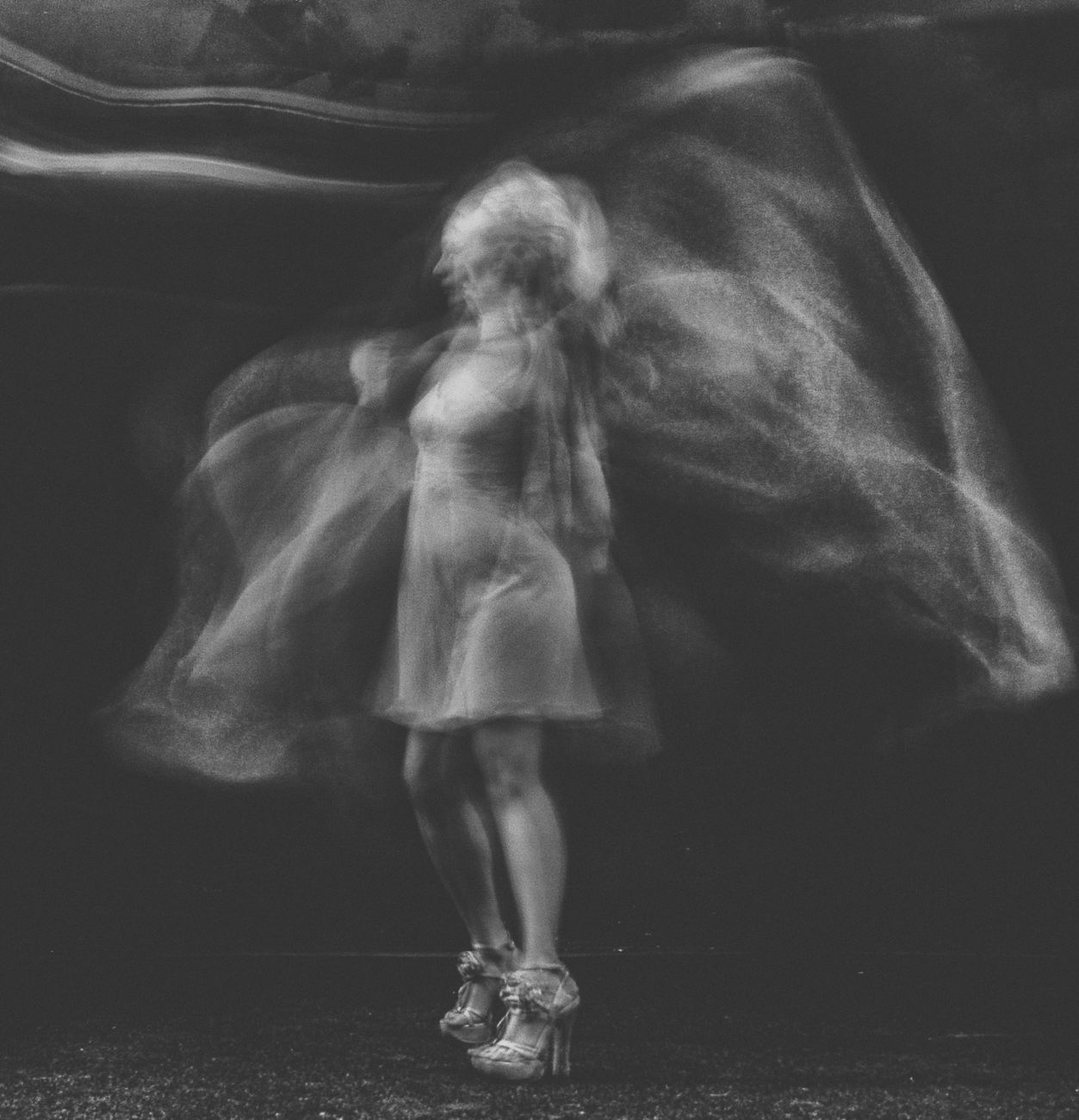 grayscale photo of dancing woman